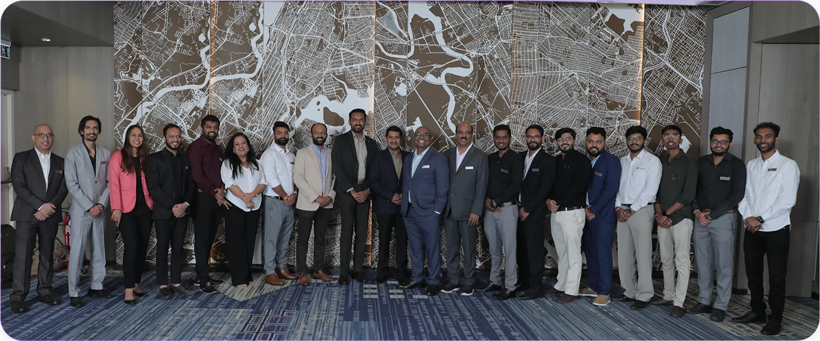 LoyaltyXpert team in front of a marble wall